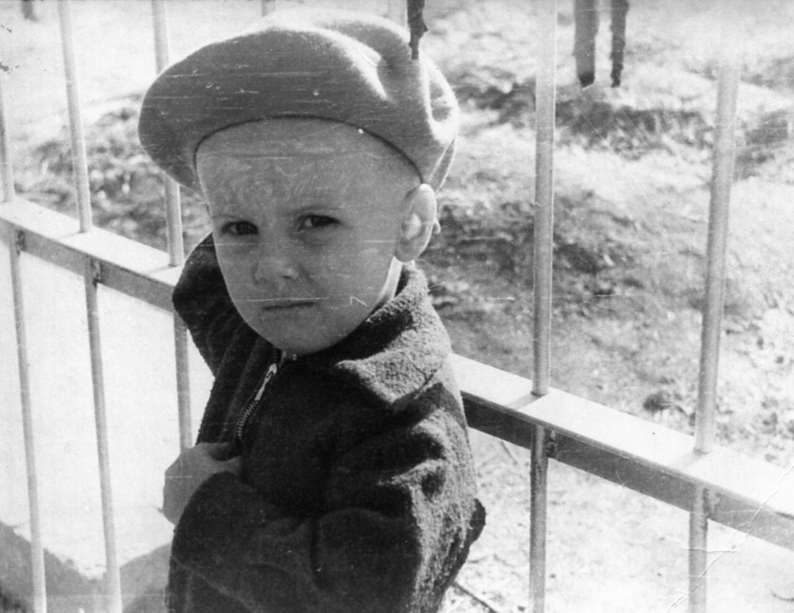 Andrii Nikolaiev at father's grave (age 2) — Digital Polygraph founder family legacy