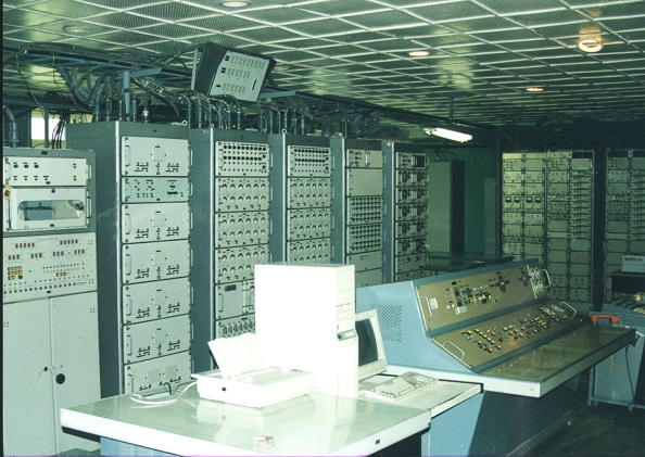 Vega system hardware room with equipment racks and operator console from 1995